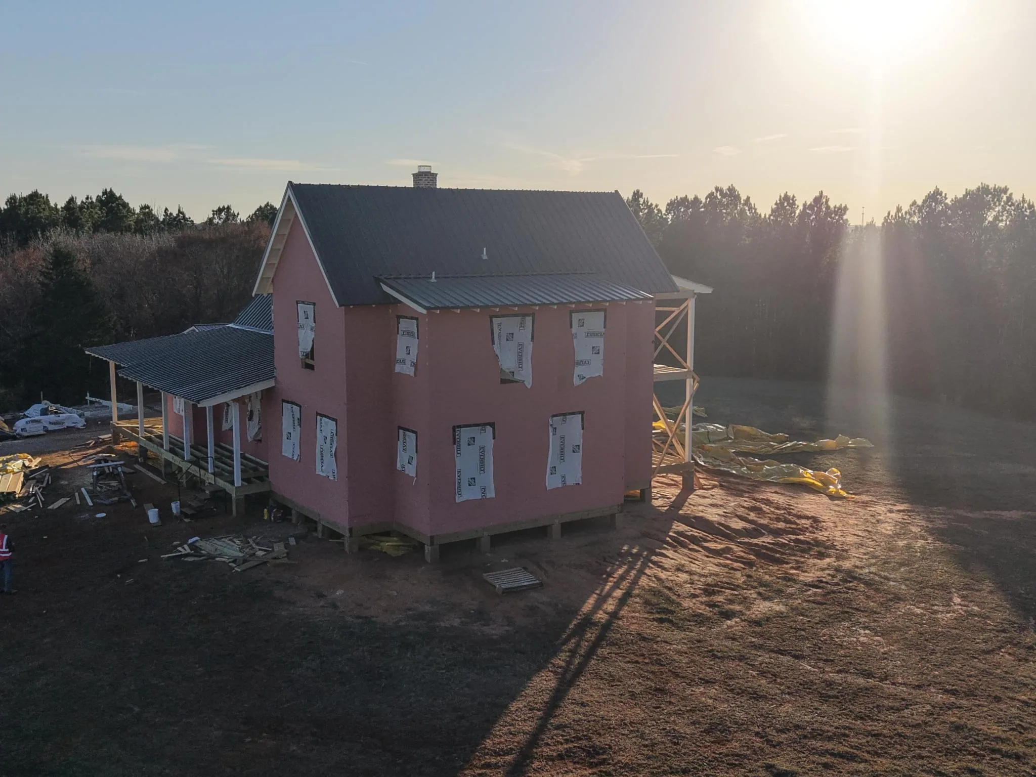Sunbeams over a Novarum farmhouse under construction in the East Texas countryside