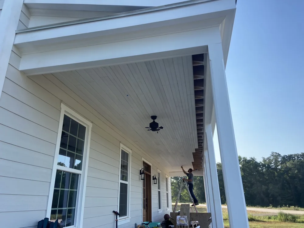 Beadboard porch ceiling and columns during finishing