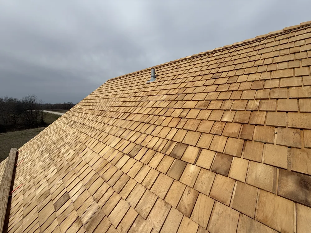 Field of fresh cedar shingles on the steep roof