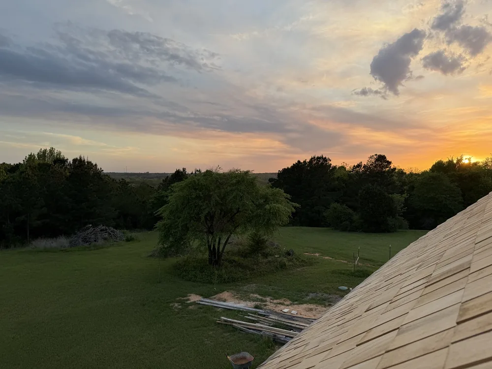Sunset over the fields seen from the rooftop