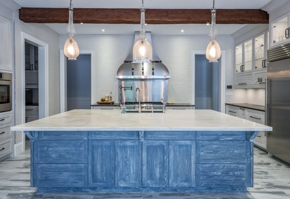 Custom kitchen with cerused oak island, marble counter, and hand-fitted cabinetry in the Monaco House